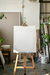 Blank Canvas on Easel in Bright Art Studio