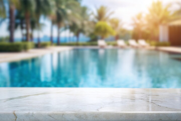 Fototapeta premium white marble top with blurred empty Swimming pool background can be used for mocking up or display product to make advertising.