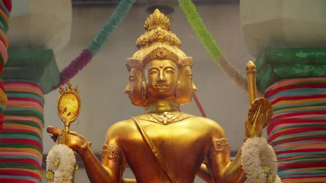 Smoke From Burning Incense In Front Of Four-Faced God Statue, Brahma (Phra Phrom) At Temple. closeup