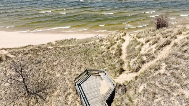 Reverse track and tilt motions showing the beach area.
