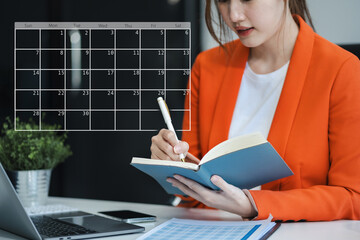 Business woman using digital tablet with calendar planner and organizer to plan and reminder,...