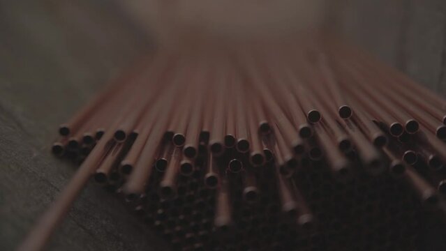 Stack of Copper tubes for heat exchangers. Lots of pipes to produce. Heating element. Factory production.