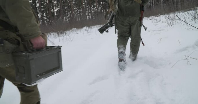 Usa Army Soldiers Of World War Ii. Re-enactors Dressed As American Infantry Soldier Going Through Forest Road With Mortar. Two Usa Soldiers Marching By Country Road. Slow Mo Slow Motion Slow-mo.