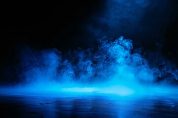 Abstract scene of smoke on a dark background with blue light and smoke