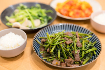 Asian family dinner with fry egg and beed with vegetable at home
