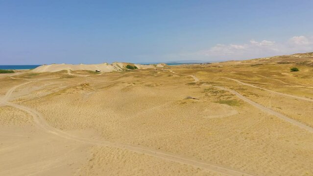 Top view of Paoay sand dune. Sand dunes near to the sea with sky. Ilocos Norte, Philippines.