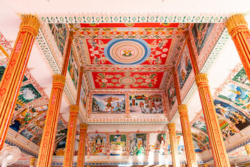 colorful paintings on the interior of a buddhist temple in Vientiane Laos