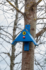 Bird house on tree trunk Kumla Sweden