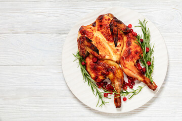 butterflied, spatchcock roast chicken on a plate