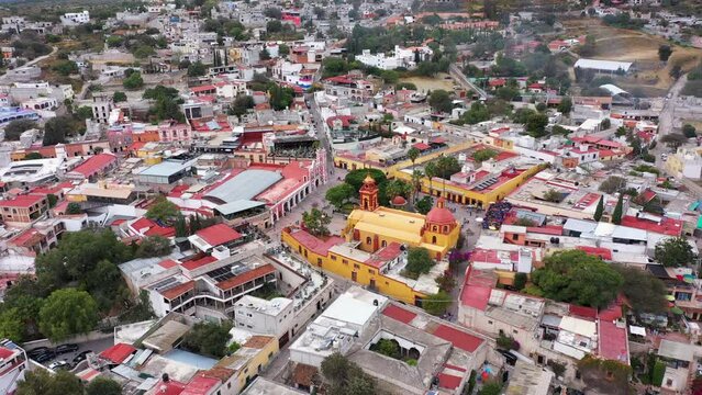 Misty morning view of the historic colonial church and city center of Bernal, Quer&eacute;taro, Mexico.