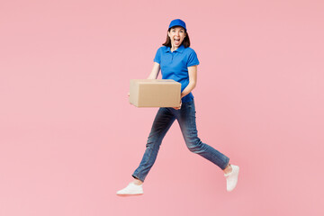 Full body surprised shocked delivery employee woman wear blue cap t-shirt uniform workwear work as...