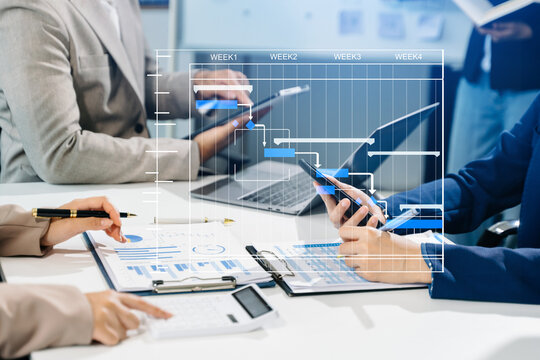 Project manager working and update tasks with milestones progress planning and Gantt chart scheduling diagram.