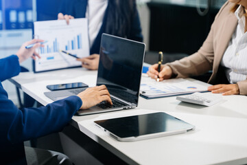  Business team meeting present.professional investor working with  Finance managers task. with laptop smart phone and digital tablet