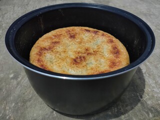 Photo of hardened rice, dry rice on magic com, the rice is dry and then hardens until it turns brownish (burnt rice, crusty rice)