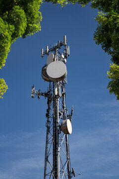 Metal tower with 5G antennas, parabolas