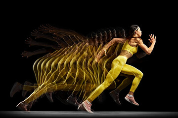 Concentrated and focused young woman, athlete in motion, running, training against black background...