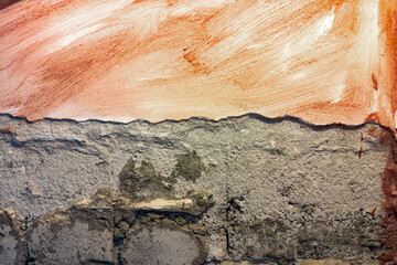 Industrial background. Old brick wall with plaster stains. Structural plaster on the wall