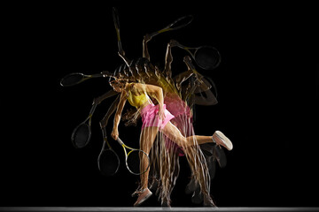Competitive young girl, tennis player in motion in colorful sportswear training against black...