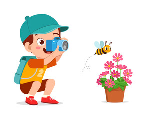 little kid holding camera and take photo of bee