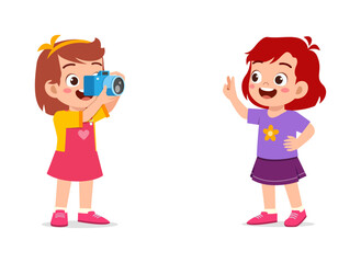 little kid holding camera and take photo of friend