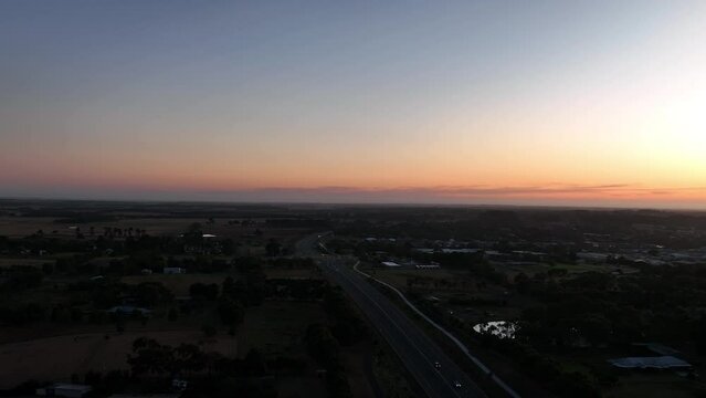 Drone shot at sunset over road