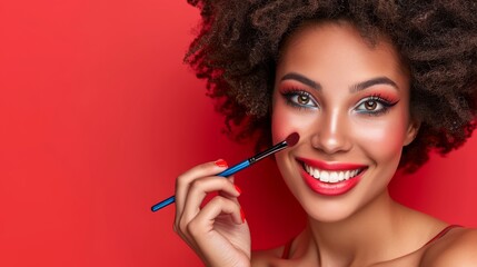 Obraz premium Portrait of a beautiful woman doing makeup on a red background