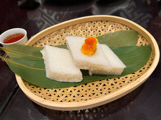 Chinese White Sugar Cake Dim Sum in a bamboo basket