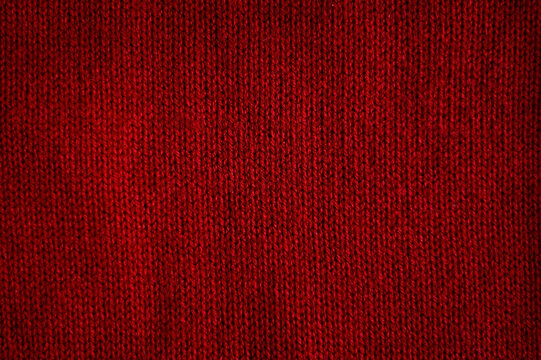 Red fabric texture background. Texture of red sweater