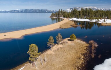 Baldwin Beach on a calm Lake Tahoe. .Mount Tallac, South Lake Tahoe, California, United States of...