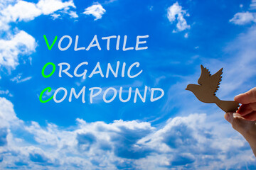VOC volatile organic compound symbol. Concept words VOC volatile organic compound on beautiful blue...