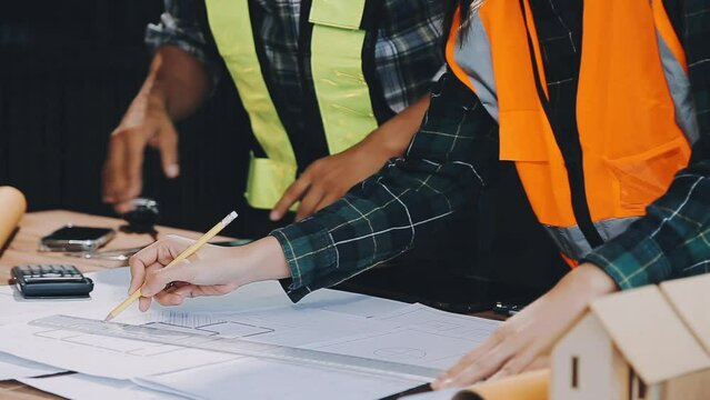 Business Meeting Time with Architecture Interior Designer and Engineering. Meeting and Discussion about Construction Progress in work and Figures denoting of Accounting and Financial