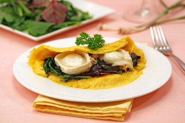 Mixed fresh leaves omelet with young garlic and goat cheese.