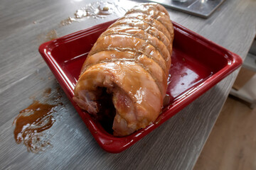 Traditional italian porchetta. Rolled pork belly stuffed with mincemeat and herbs.