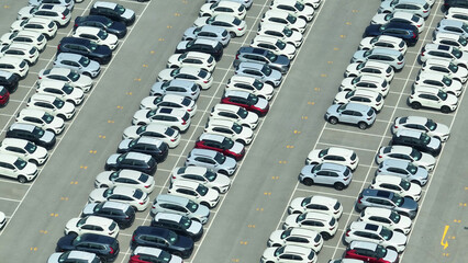 A birds-eye view unveils the potential of tomorrow's journeys. Rows of gleaming new cars, like...