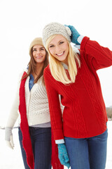 Portrait, friends and happy women in snow for holiday, vacation or travel together outdoor in Switzerland. Winter clothes, smile and girls hiking in nature for adventure, journey and countryside trip