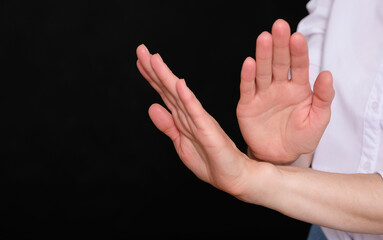 A woman shows gesture of refuse something