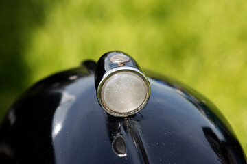 vintage car detail of a silver side wing light
