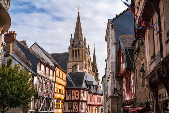 View of the typical Breton houses and in the background the Cathedral Basilica of Saint Peter appears. Photography taken in Vannes, Brittany, France.