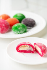Multi-colored Japanese cakes Mochi in a white plate