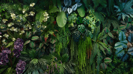 Naklejka premium Group of dark green tropical leaves background, Nature Lush Foliage Leaf Texture, tropical leaf.