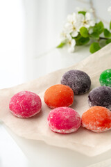 Multi-colored Japanese cakes Mochi in a white plate