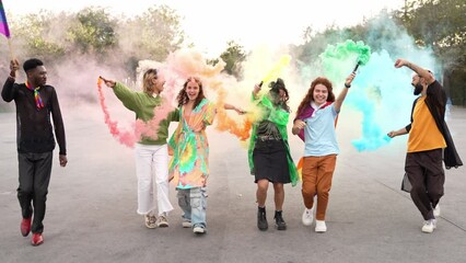 Young diverse alternative friends having fun with colourful smoke - LGBT festival