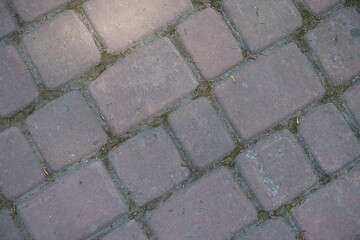 Closeup of old and dusty pale pink concrete pavement