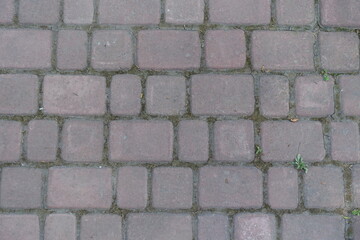 Texture of old and dusty pale pink concrete pavement