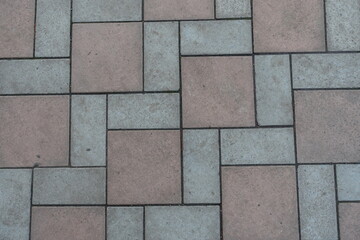 Obraz premium Background - geometric pavement made of grey and brown concrete tiles