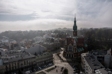 Aerial view of Podgorski Square with St. Joseph's Church during foggy morning in Podgorze District...