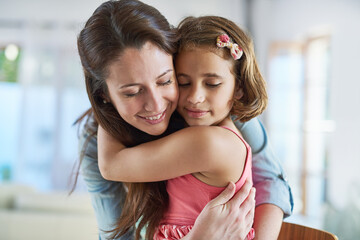 Face, calm mother and girl hug for support in home for care, safety and bonding together to relax. Smile, love and proud single parent mom with kid for security, daughter or child in family house