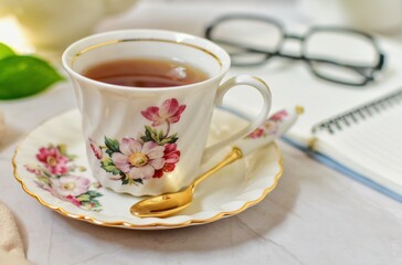 Afternoon tea , hot tea In a flower pattern tea cup, 