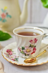 Afternoon tea , hot tea In a flower pattern tea cup, 