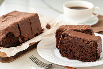 Fresh homemade chocolate sponge cake on wooden board